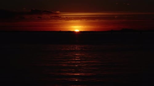 Setting Sun Reflects on Lagoon Creating Sunlight Path