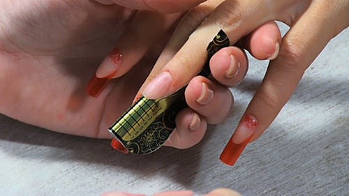 Applying Decorative Nail Polish for Fashionable Manicure