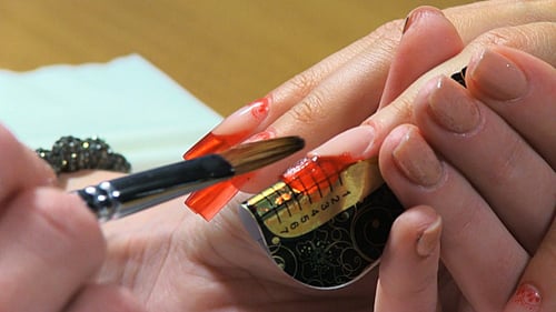 Manicurist Applies Nail Polish in Beauty Salon