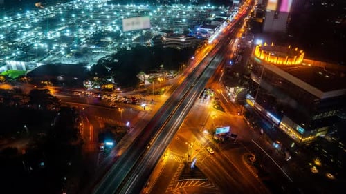 Time Lapse of Busy Highway Road Junction in Metropolis City Center at Night