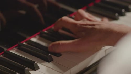 Hands Playing Piano Keyboard Close Up