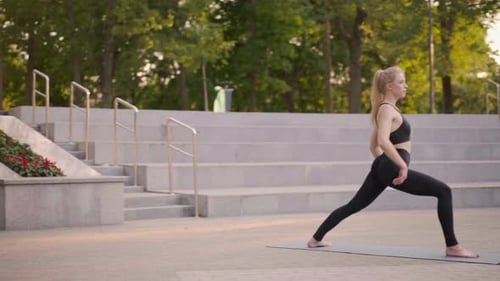 Fitness Woman Practice Yoga Exercises On Mat Outdoor City Street Sunlight Background