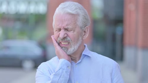 Senior Man Experiencing Severe Toothache Pain