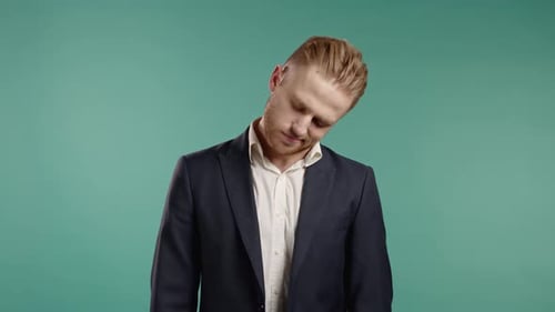 Young Adult Man Stretches Neck for Relief