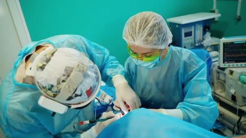 Surgeons Performing Operation in Hospital Operating Room