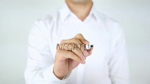 Man Writes "Negative" on Screen with Marker