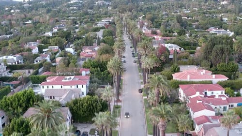 Drone ascending over the Beverly Hills suburban street to reveal beautiful landscape of Los Angeles