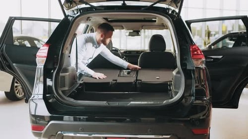 Man Choosing Vehicle in Showroom