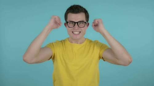 Excited Man Pumping Fists in Celebration