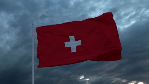 Waving Swiss Flag Against Cloudy Sky
