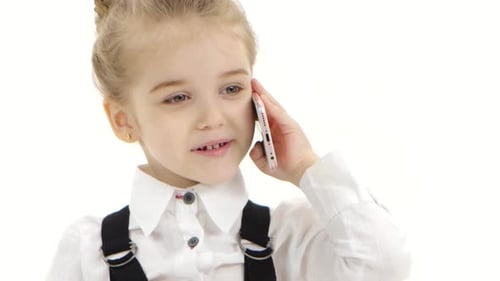 Little Girl Chatting on Phone in Studio