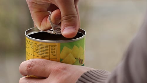 Man Opens Canned Food