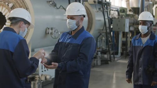 Plant Shift Supervisor Disinfecting Workers Hands