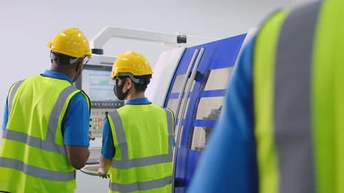 African American factory worker man work with team and also Caucasian manager join