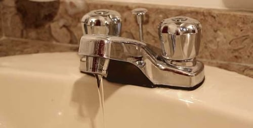 Running Water From Silver Bathroom Faucet