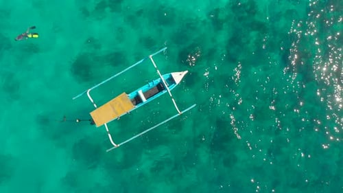 Turquoise Water and Boat Snorkeler Swims