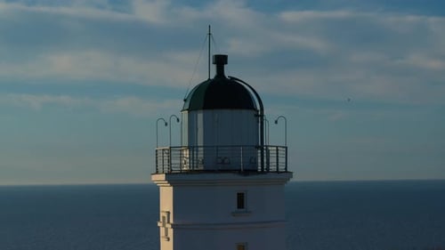 Drone View Lighthouse on Coastline at Morning Sunrise