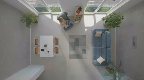 Woman Using Laptop in Modern Interior From Above