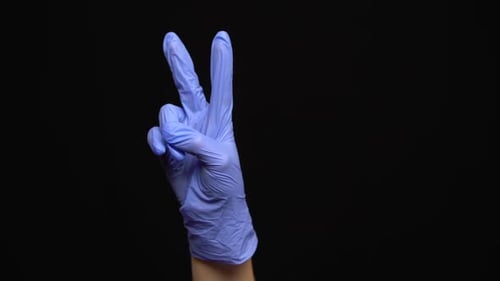 Hand with Glove Making Peace Sign