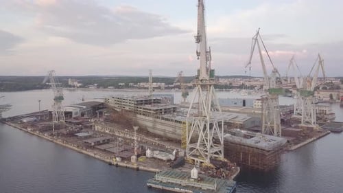 Aerial View of Shipyard with Ship Under Construction