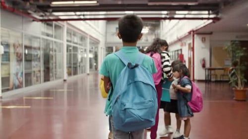 Children Chatting in School Hallway