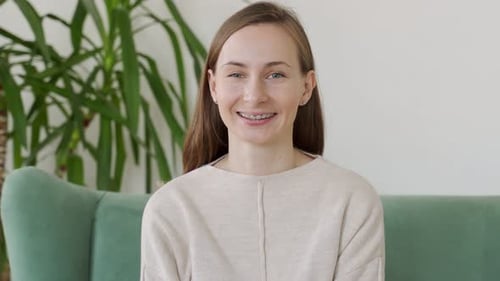 Smiling Young Woman with Braces Portrait