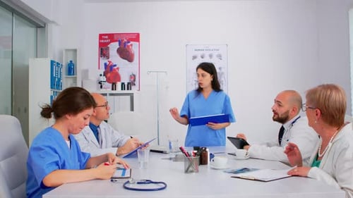 Medical Professionals Collaborate in a Hospital Conference Room