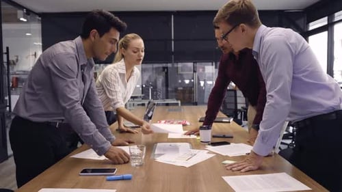 Team Discussing Business Plans in Modern Office