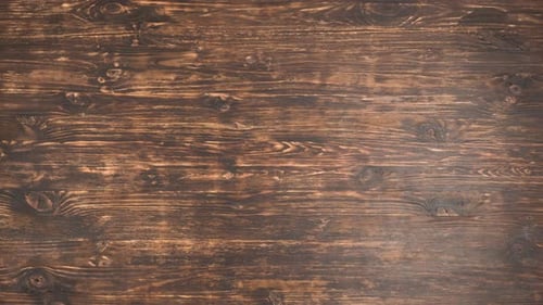 The Fork and Knife Move on a Wooden Table