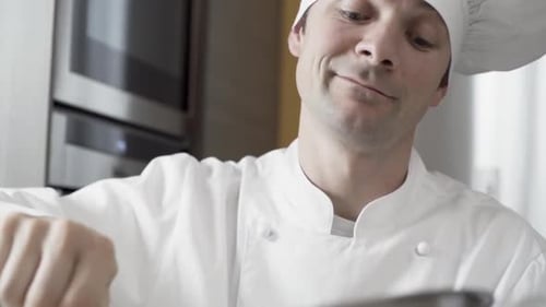 Chef Stirring Ingredients in Kitchen