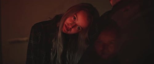 Close up of Two Friends Embracing in Night