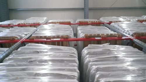 Warehouse Storage of Plastic-Wrapped Pallets on Metal Shelves
