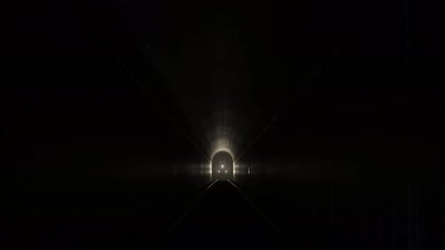 Train leaving an old underground tunnel. Railway transportation. Dark foggy.