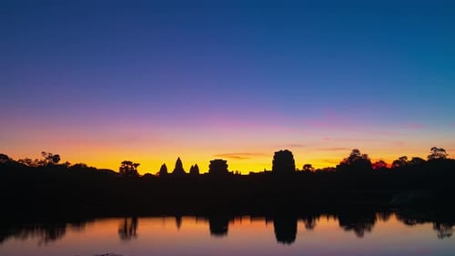 Sunrise time lapse at Angkor Wat main facade silhouette. World famous temple in Cambodia
