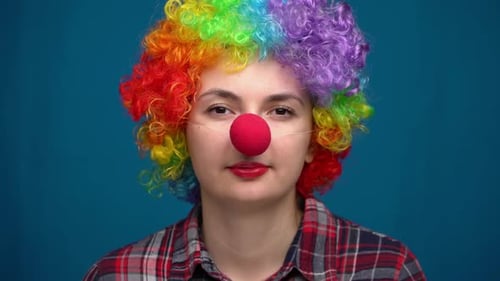 Woman Wearing Clown Wig and Red Nose