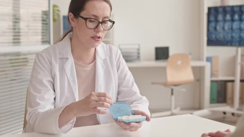 Doctor Explains Medication to Patient in Clinic