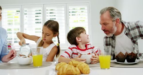 Family Enjoying Breakfast Together at Home