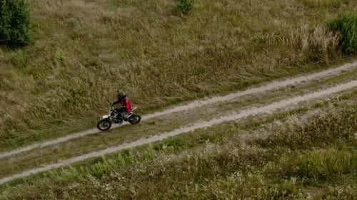 Aerial Drone View of Motorcycle Drivers Traveling on a Country Road