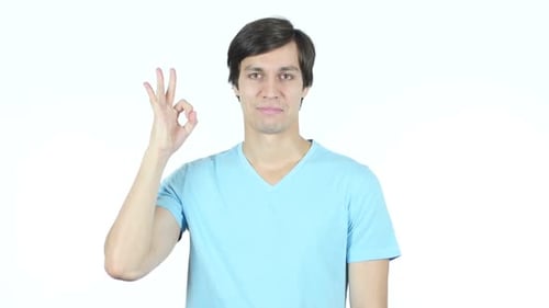 Young Adult Man Giving OK Hand Gesture