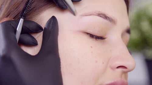Eyebrow Shaping with Tweezers Close Up