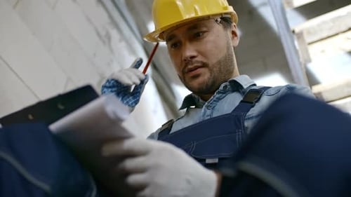 Asian Construction Worker with Clipboard