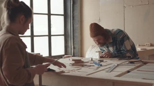 Pair of Joiners Working in Carpentry Workshop