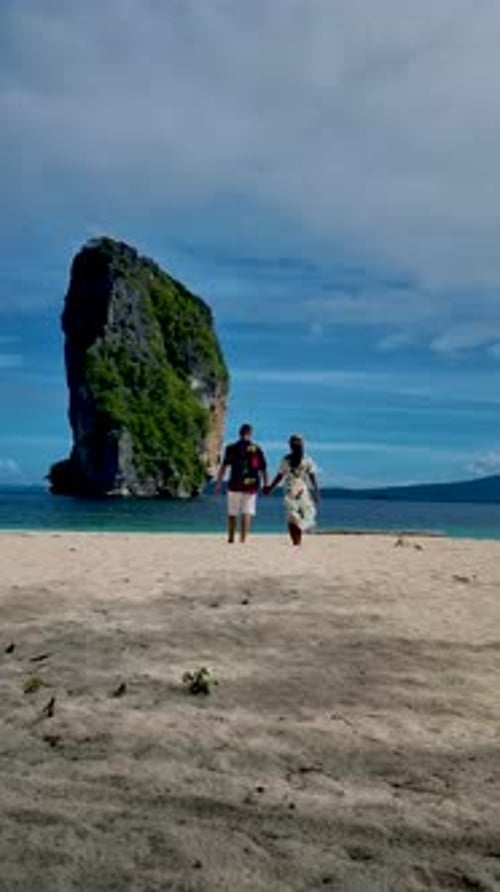 Koh Poda Krabi Thailand Asian Woman and European Men Walking on the Tropical Beach of Koh Poda