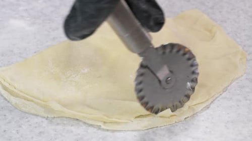 Closeup Shot Hands Black Gloves Bakery Chef Applying Flour Dough Isolated Background Footage