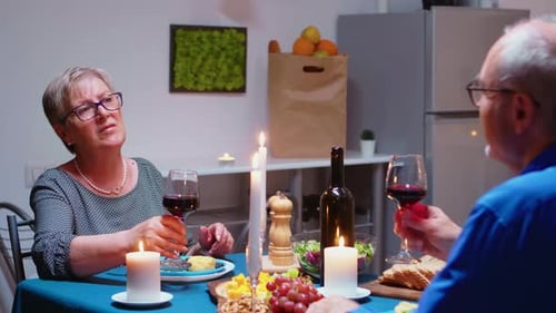 Romantic Dinner with Wine for Mature Couple at Home