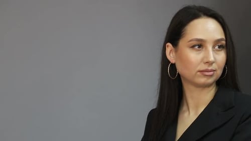 Attractive Woman in Black Blazer Looking Away
