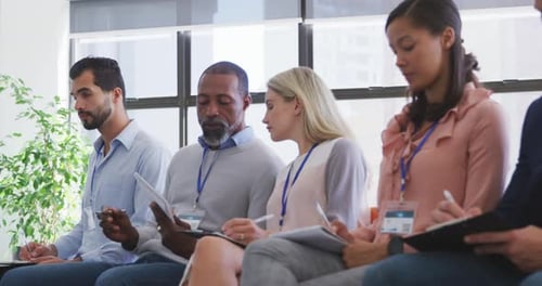 Business people attending to a meeting in conference room