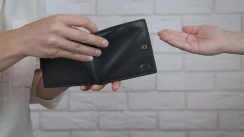 Empty Wallet Offered to Clenched Hand