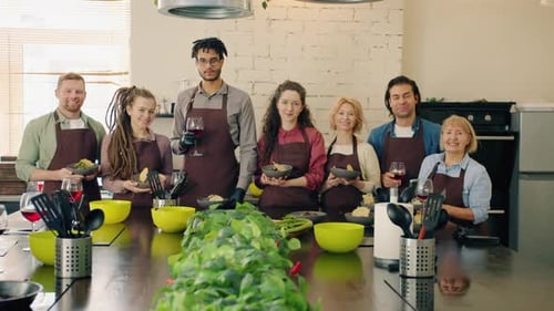 Portrait of Diverse Group of People Standing in Cooking School Holding Food and Drinks