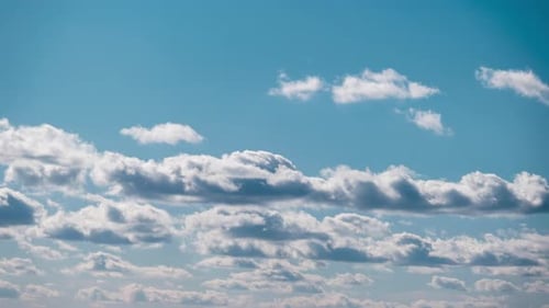 Puffy White Clouds in a Blue Sky Time Lapse